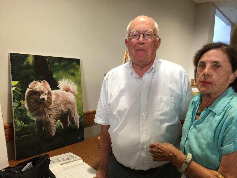 WH12.230102548_std Earl and Mary Ellen Edwards admire the wonderful painting of this dog named